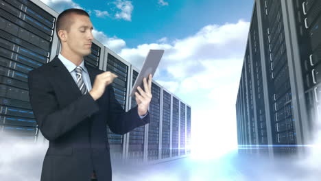 businessman using tablet computer in front of server tower on sky background