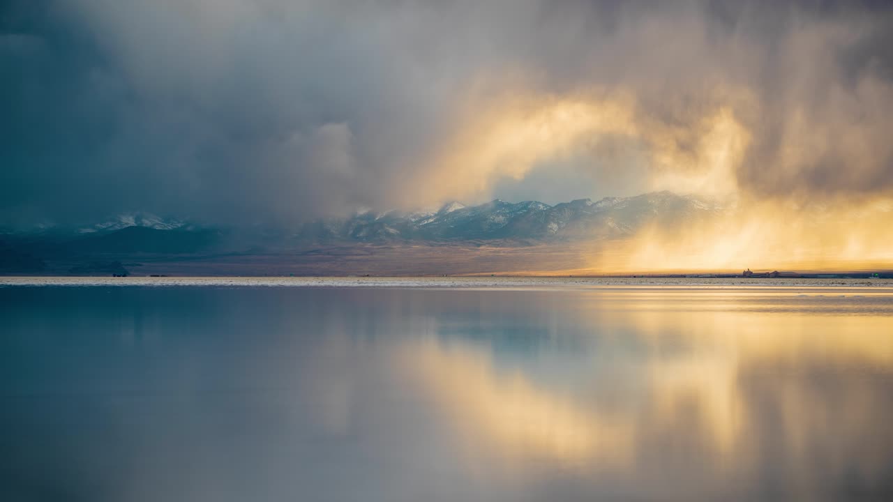 Real Timelapse of Rainy Clouds Mirror Reflection on Calm Water at Sunset