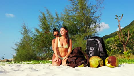 happy young women preparing for sunbathe putting sunscreen on body for tanning on tropical sun in malaysia