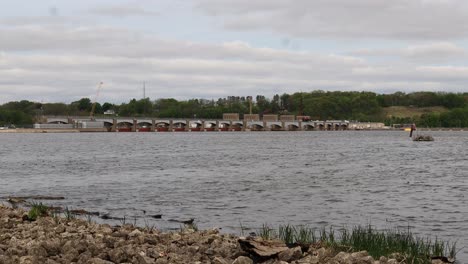 View-of-Lock-and-Dam-14-on-the-Mississippi-River-on-a-cloudy-spring-day,-near-LeClair-Iowa---looping