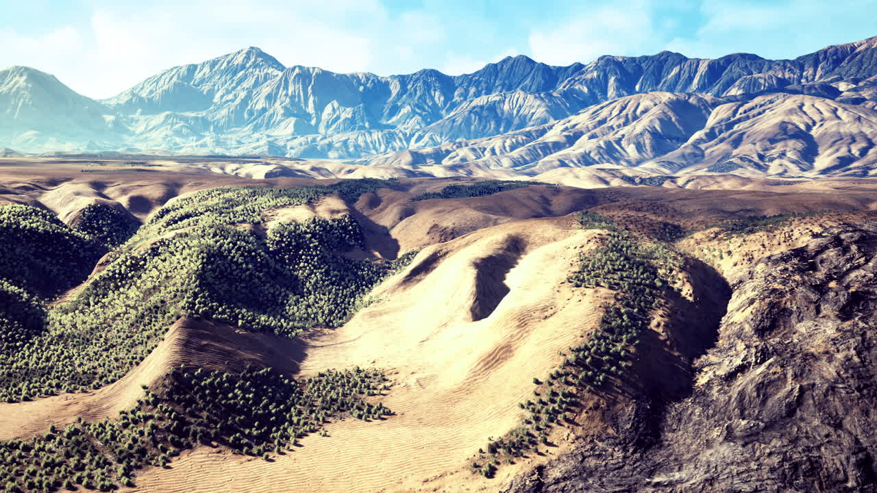 Vast mountain landscape revealing rugged terrain and serene valleys at dawn