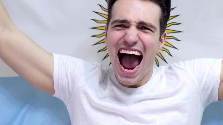 Argentinian Young Man celebrates holding the Flag of Argentina in Slow Motion