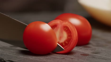 slicing a fresh tomato with a knife