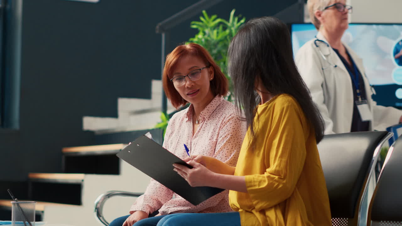 Patient and doctor discussing in hospital waiting room