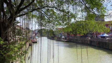 Slow-motion-scene-of-a-bright-sunny-day-river-view-of-Malacca-,-Malaysia