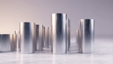 rows of silver metal cylinders on a light surface