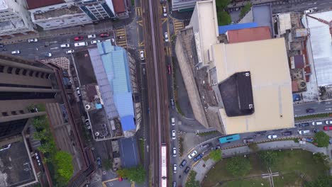 Urban-city-landscape-train-on-Railroad-track,-skyscrapers