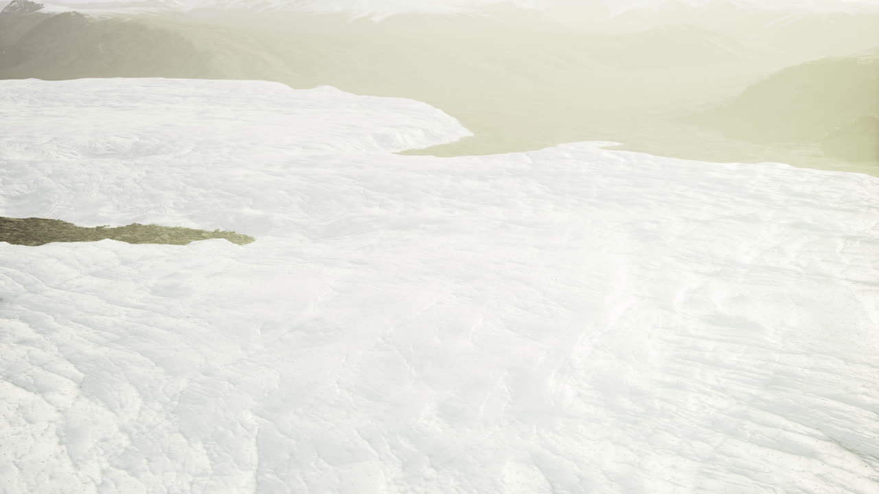 Vast glacial landscape under soft sunlight with distant hills on the horizon