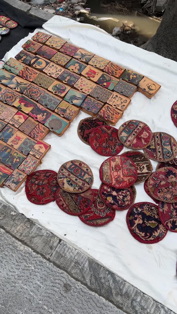 Persian carpet piece of handmade wool silk rug made by weaving traditional Iranian nomadic art with natural dye in rural countryside oriental pattern textile culture Middle East closeup lifestyle