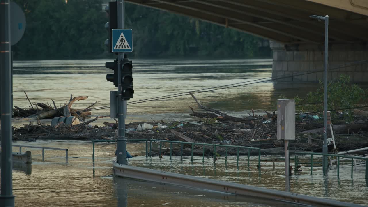 Flooded City Street with Debris and Rising Water Levels