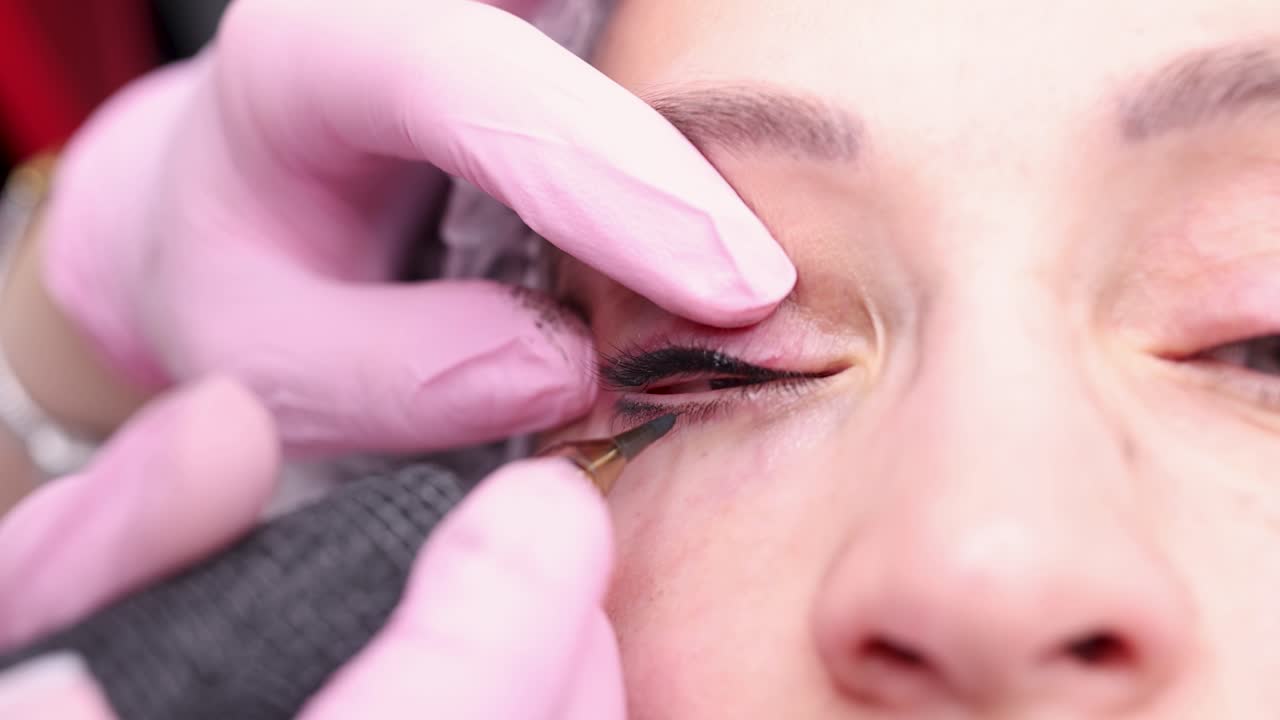 Master making black arrows in clients eyes 4k movie