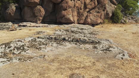 Tilt-up-Reveal-Of-Ancient-Rock-Formation-At-Harman-Kaya-Thracian-Sanctuary-In-Rhodope-Mountains,-Bulgaria