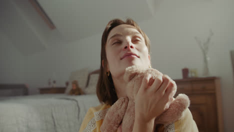 a girl playing with dolls in her room