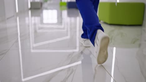 medical professional walking in a hospital corridor