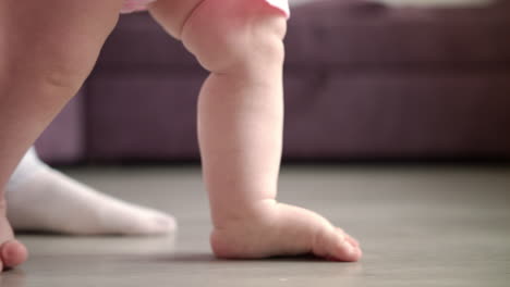 Baby-learning-walk.-Happy-new-life-concept.-Little-feet-step