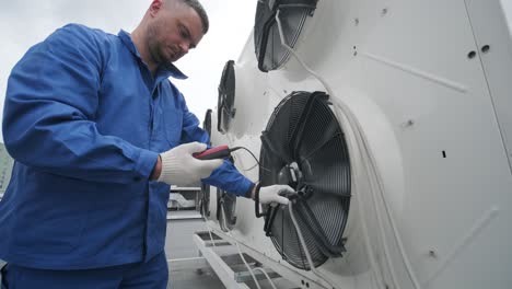 testing with an anemometer of an axial fan of the condensing unit