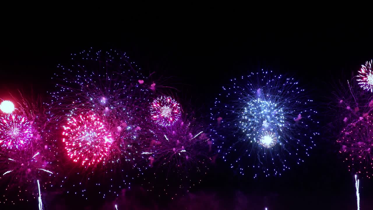 Colorful fireworks exploding in the night sky. Celebrations and events in bright colors.
