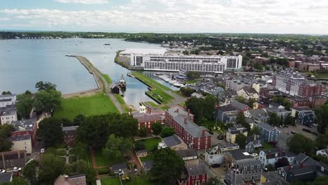 drone shot flying over salem, massachusetts customs house and looking towards the harbor