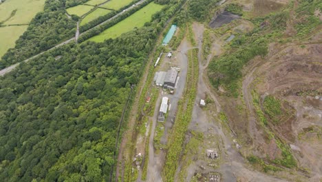 aerial view of an old aggregate quarry railway yard now largely disused and abandoned