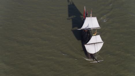 an aerial footage revolving around the halve maen ship at the middle of the sea