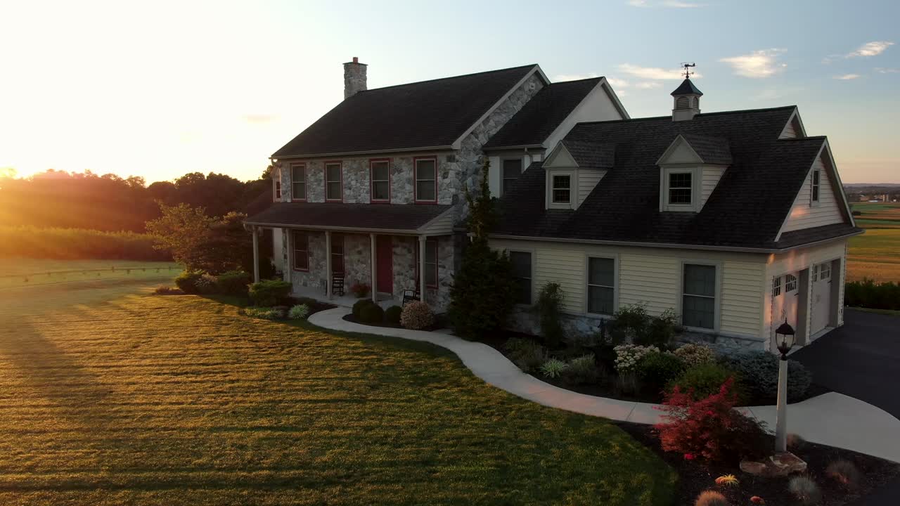 Large stone farm house during quiet morning sunrise in USA