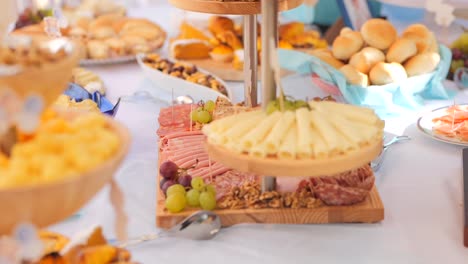 assorted pastries and breads displayed on a decorated table