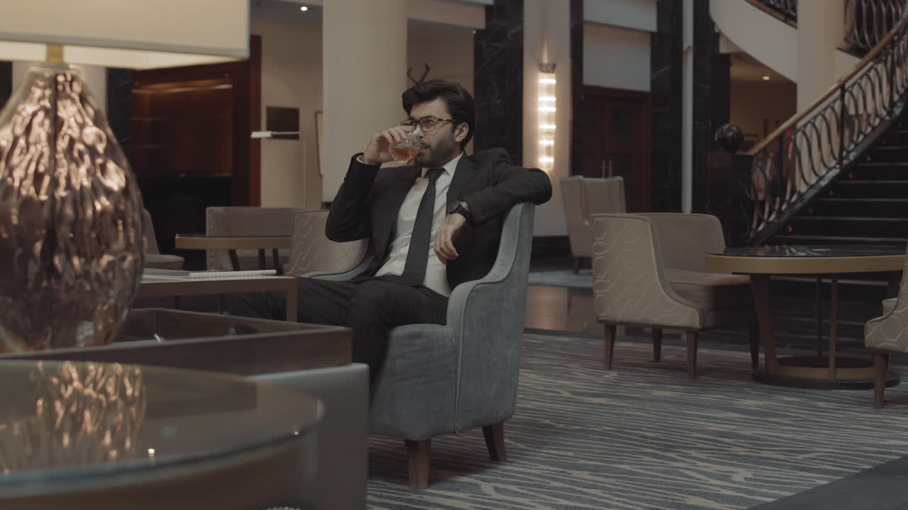 Businessman Waiting in Lobby