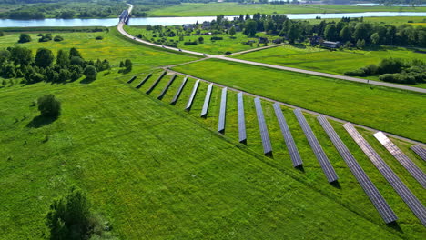 Solar-panel-farm-in-the-green-countryside-provides-clean-energy---drone-parallax