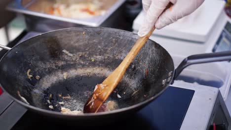 cooking stir-fry in wok