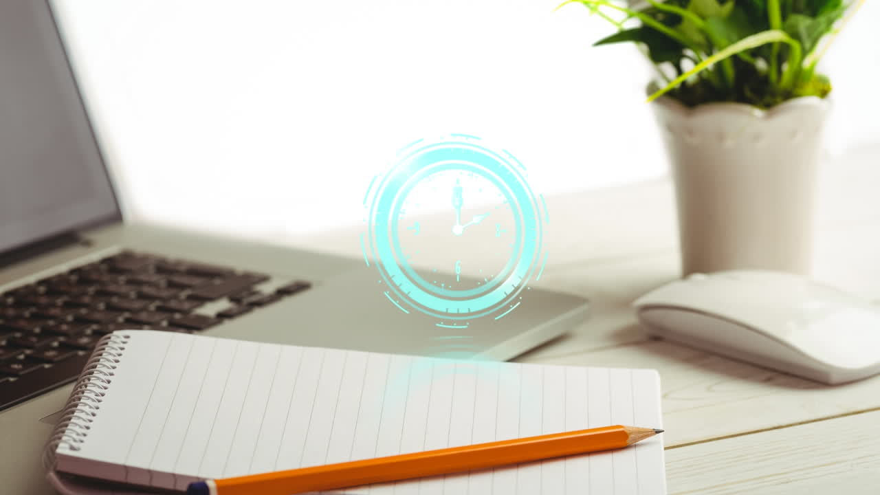책상 위의 노트북 위의 시계의 애니메이션