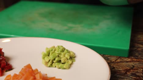 preparing fresh avocado and salmon dishes