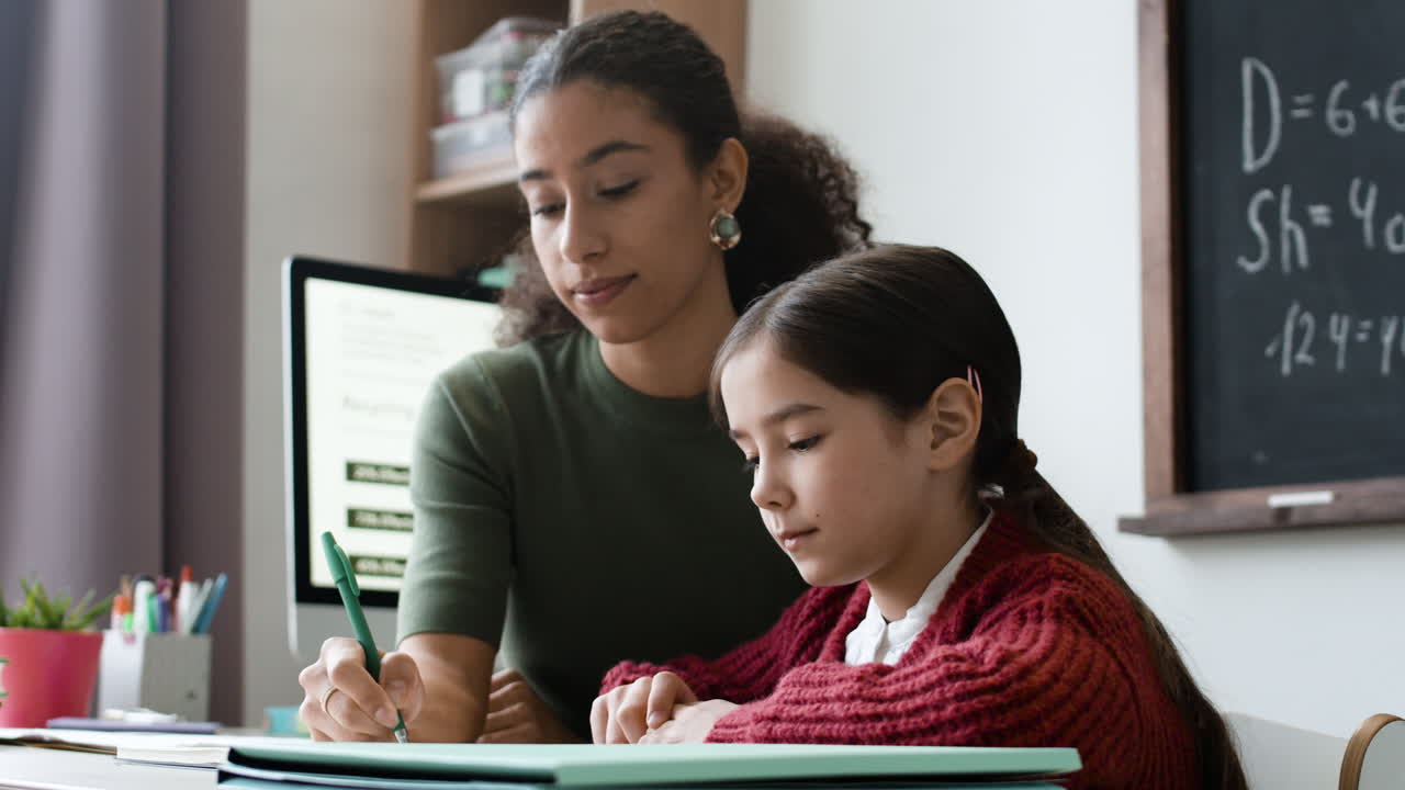 Teacher helping student with homework