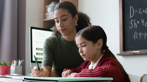 Teacher helping student with homework