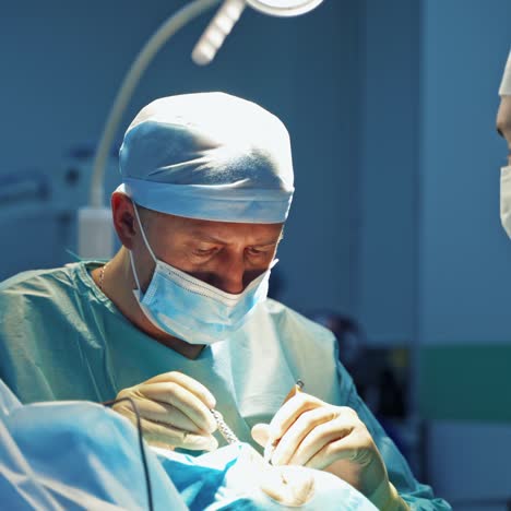 cosmetic procedure. doctors in medical uniform doing blepharoplasty. plastic surgeon operates on a patient in the operating room.