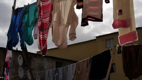 Water-dripping-from-washing-that's-hanging-on-lines-in-township-of-Langa,-Cape-Town