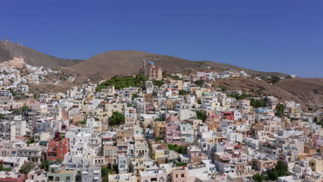 Aerial:-Slow-panning-drone-shot-of-Resurrection-of-Christ-church-in-Ermoupoli-of-Syros-island,-Greece