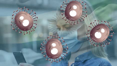animación de células de virus y bandera de argentina sobre mujer caucásica usando teléfono inteligente con máscara facial