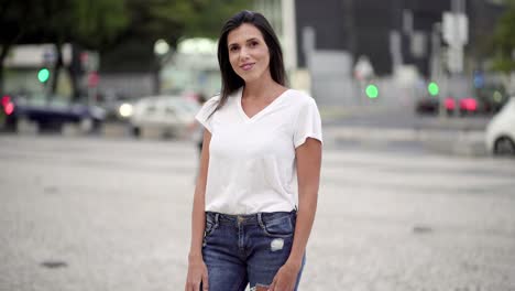 beautiful smiling young woman posing on street