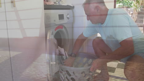 man loading laundry into washing machine with ocean waves overlay animation