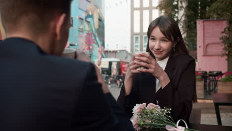 teenage boy and girl drinking coffee