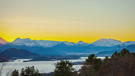 golden sunset over snowy mountain at winter. timelapse