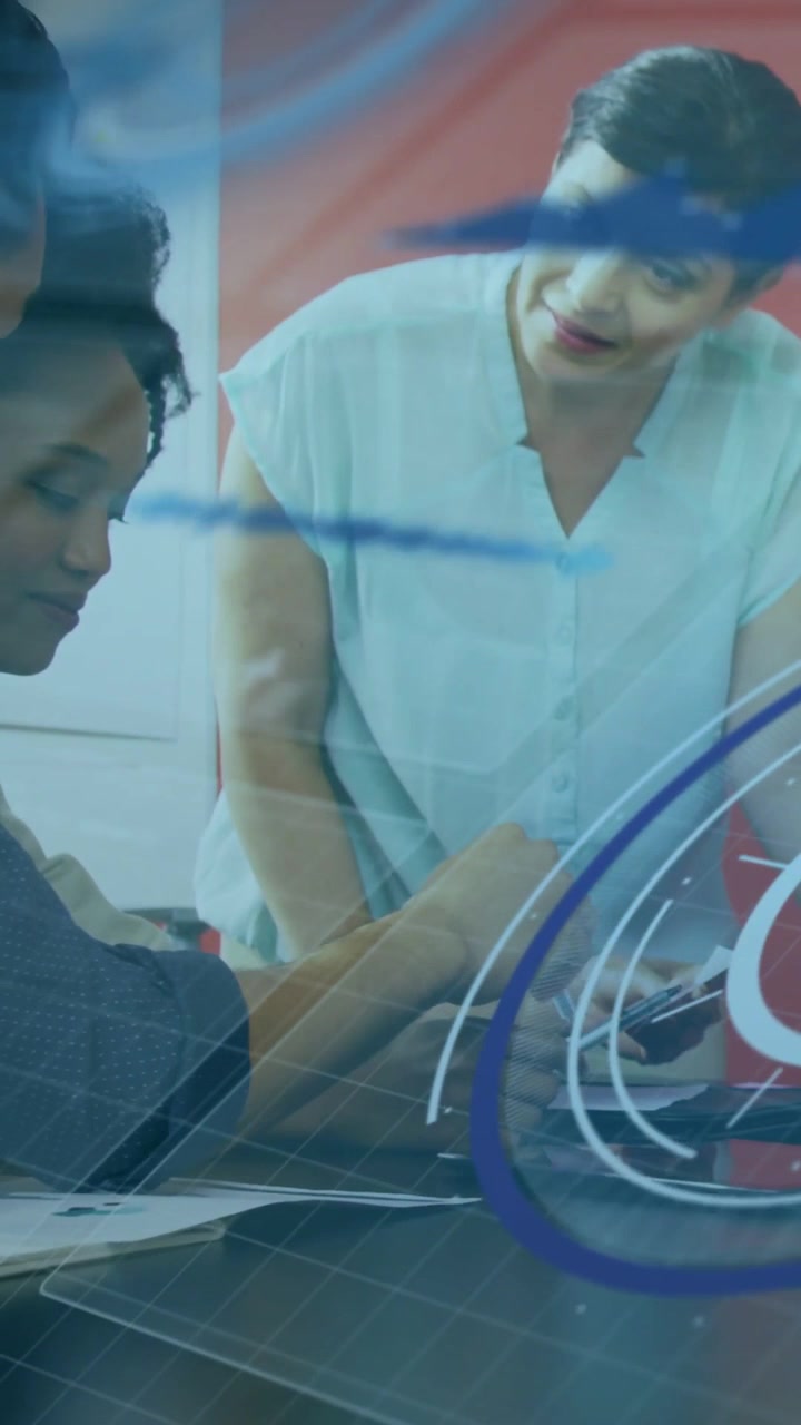 Vertical video: Tech lead entering guiding team with tablet shifting papers to device blue overlay