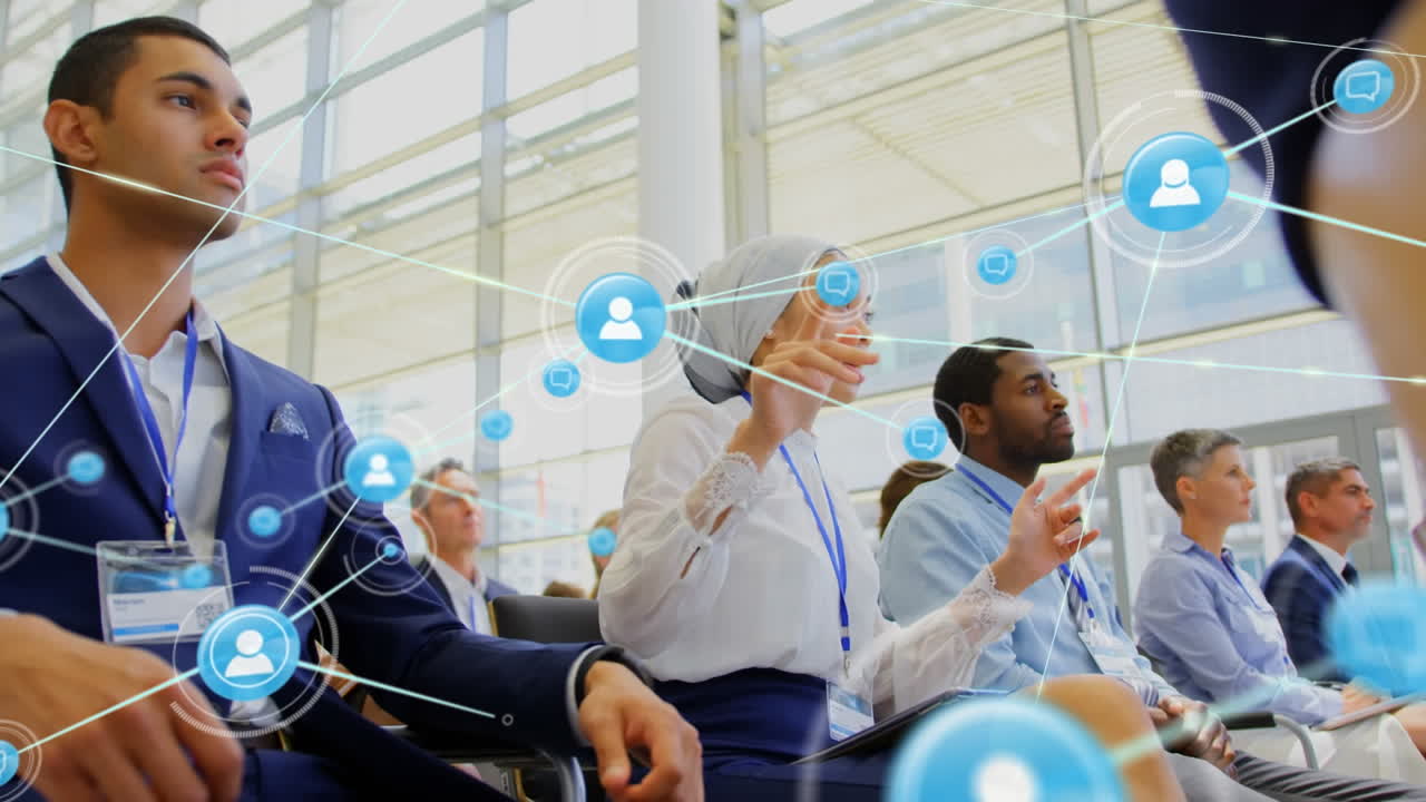 Animation of network of connections with icons over diverse business people in conference