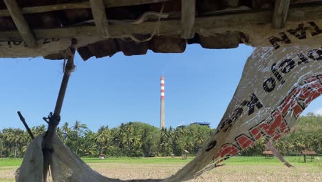 peeking at the sudimoro steam power plant covered by trees