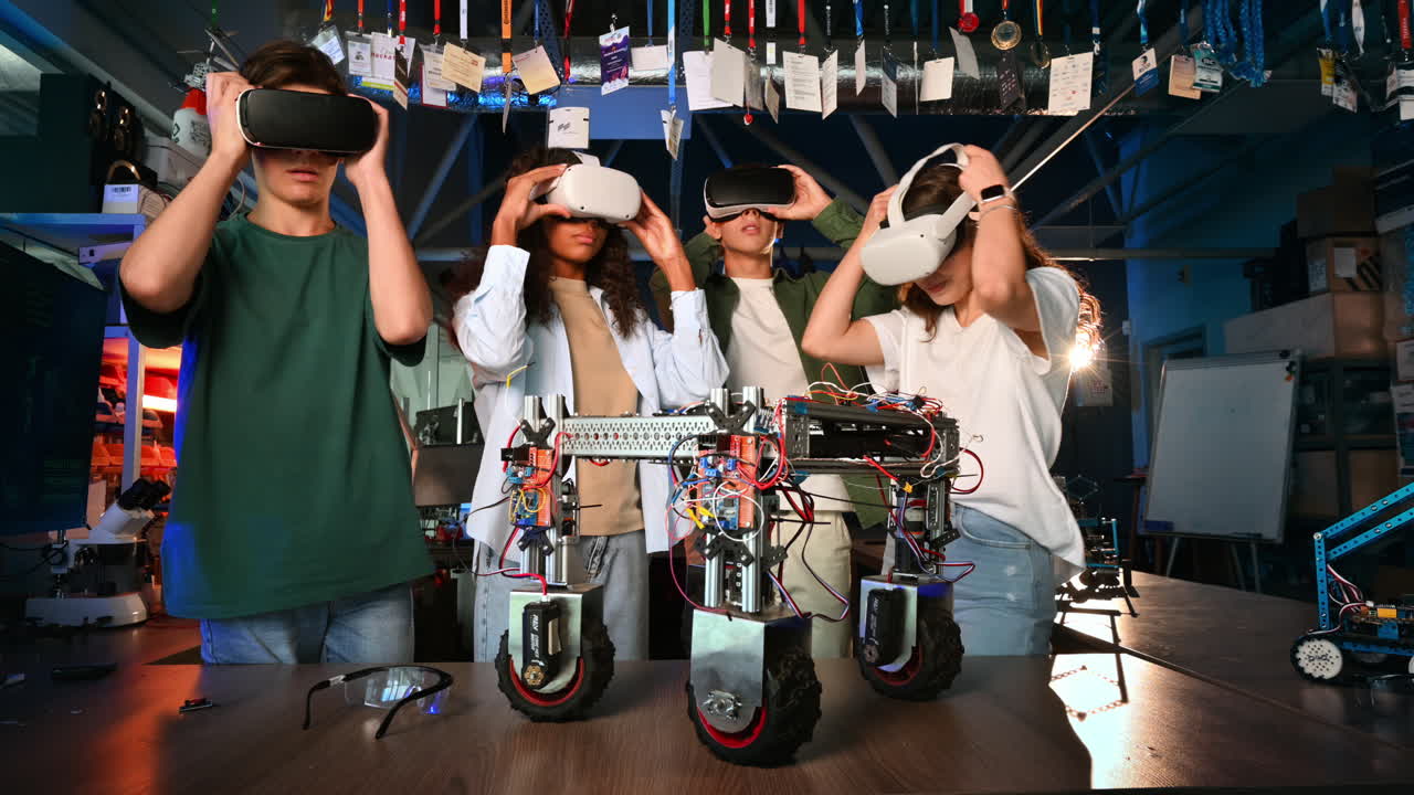 Group of young people discussing and putting on VR glasses while doing experiments in robotics in a laboratory. Robot on the table
