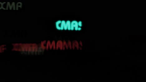 beautiful xmas text shaped bokeh from moving car and traffic lights at the evening, christmas, winter or holiday background concept, copyspace