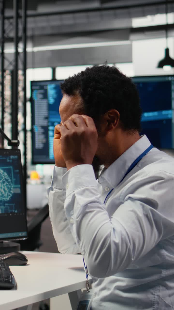 Vertical video Computer scientist working in AI startup trains predictive models