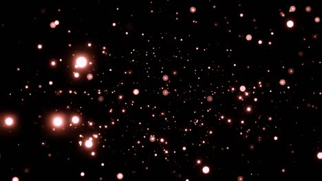 hermosas partículas brillantes de oro con destello de la lente en fondo negro en cámara lenta. partículas brillantes brillantes con bokeh. año nuevo y navidad