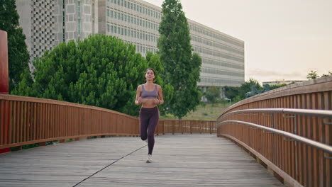 active jogger running urban park. satisfied athletic woman doing cardio training