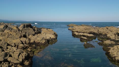 rocky beach with lagoon in caion, a coruña, spain